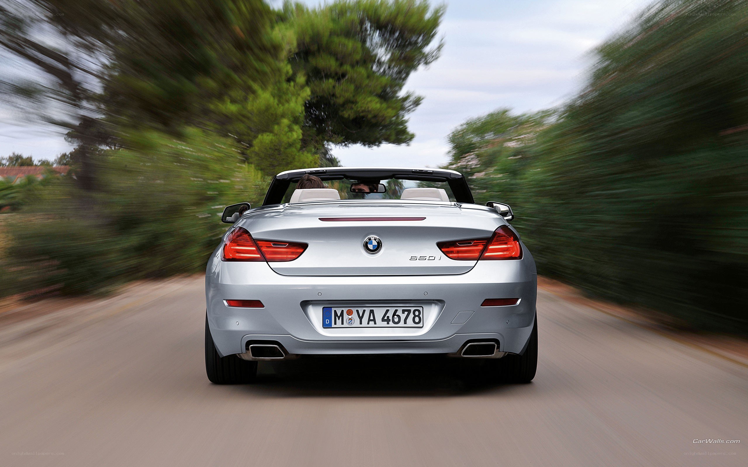 silver bmw convertible driving