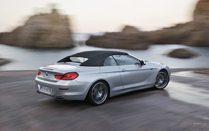 silver bmw convertible driving