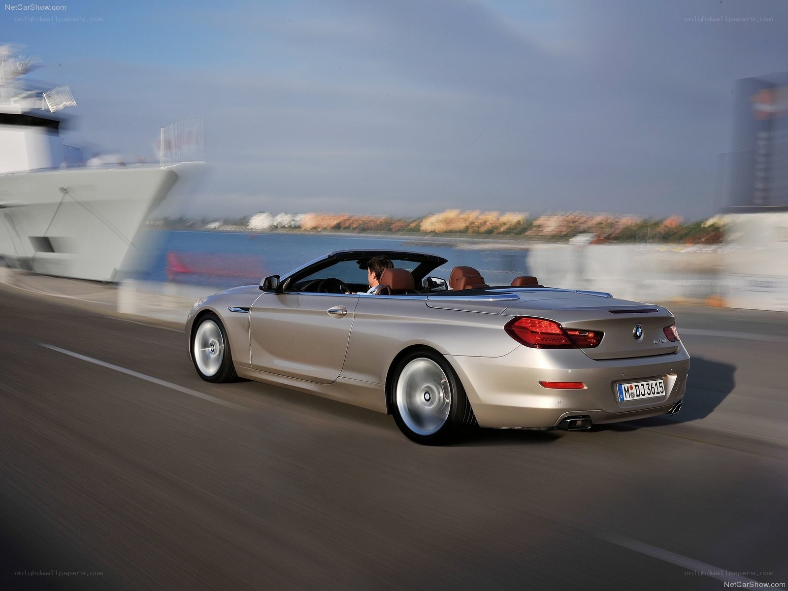 silver bmw convertible driving