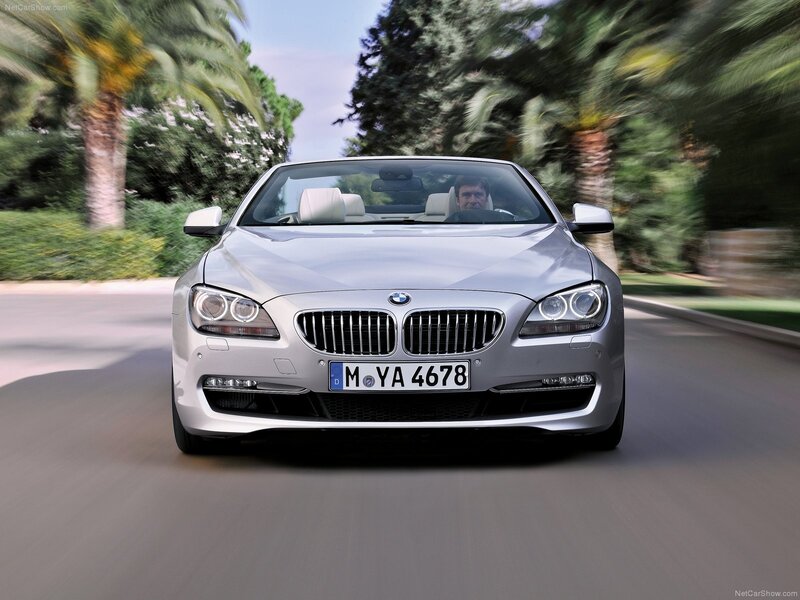 silver bmw convertible driving