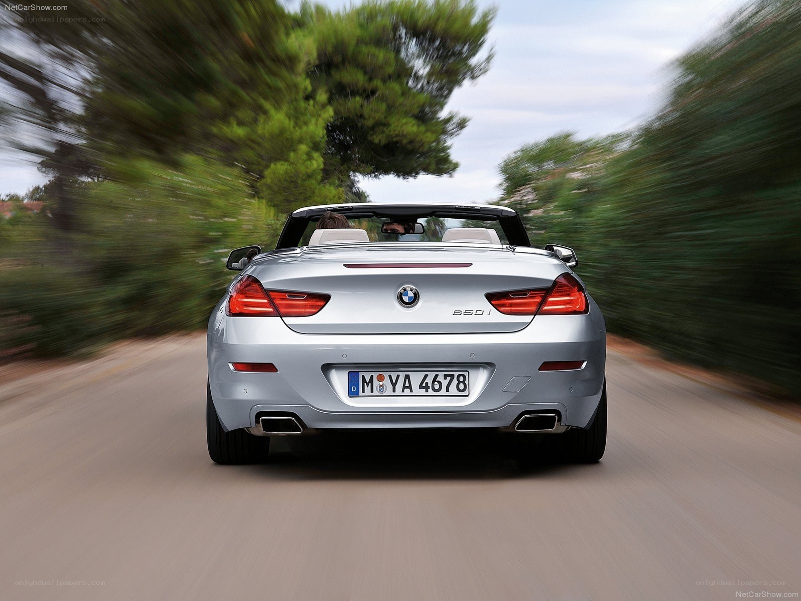 silver bmw convertible driving
