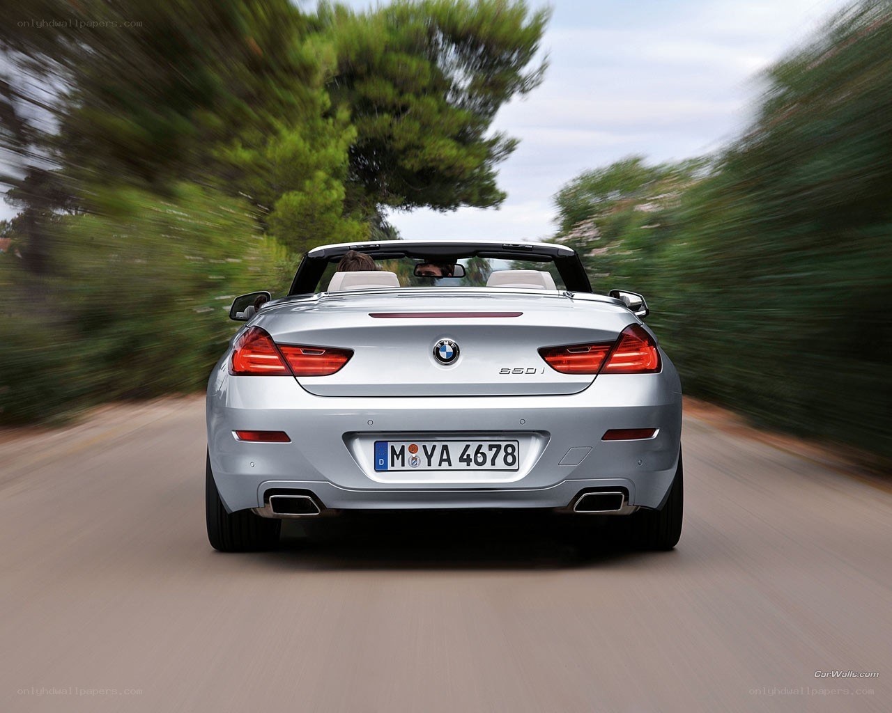 Silver BMW convertible in motion