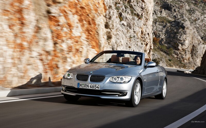 silver bmw convertible on mountain road