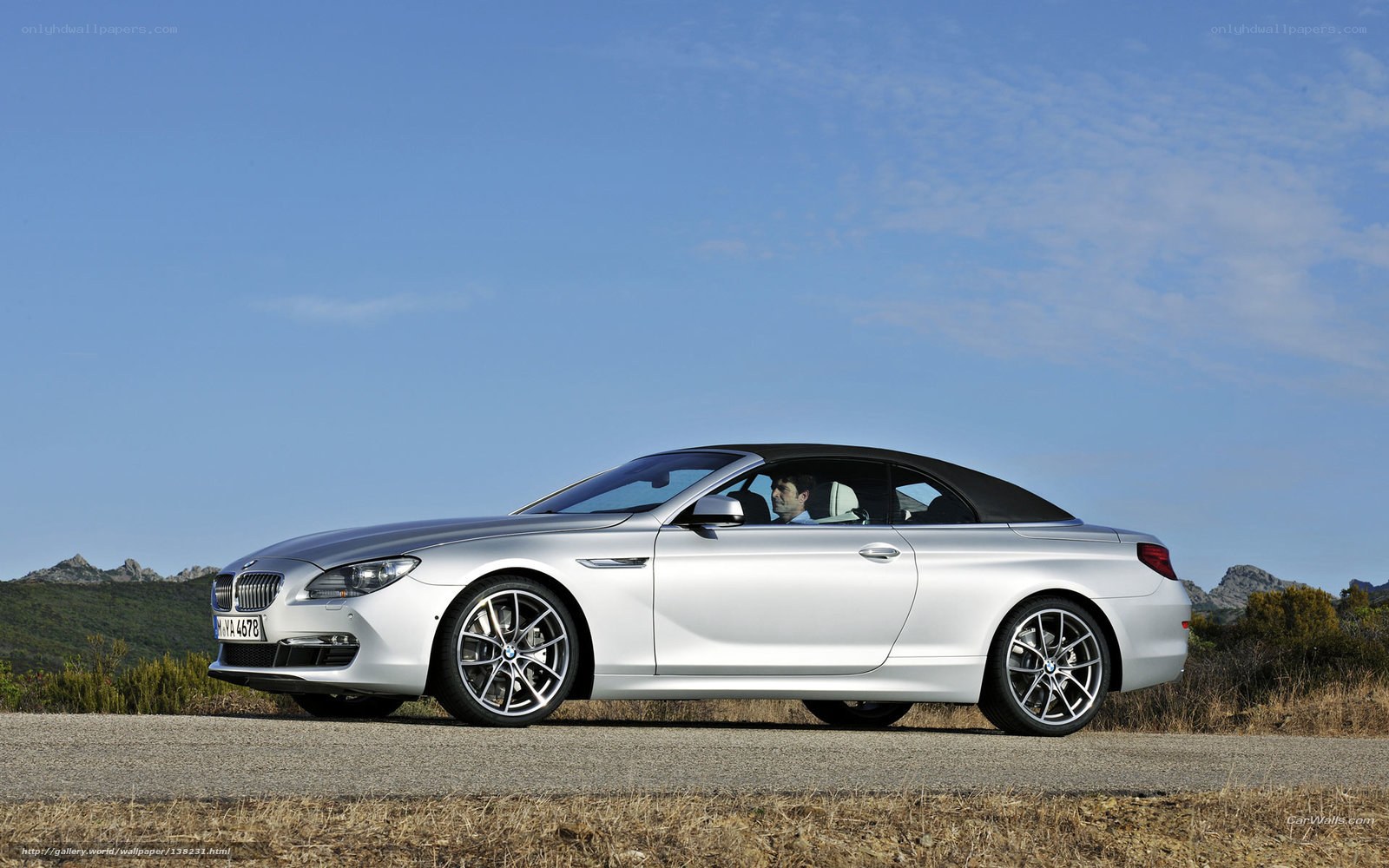 silver bmw convertible on road
