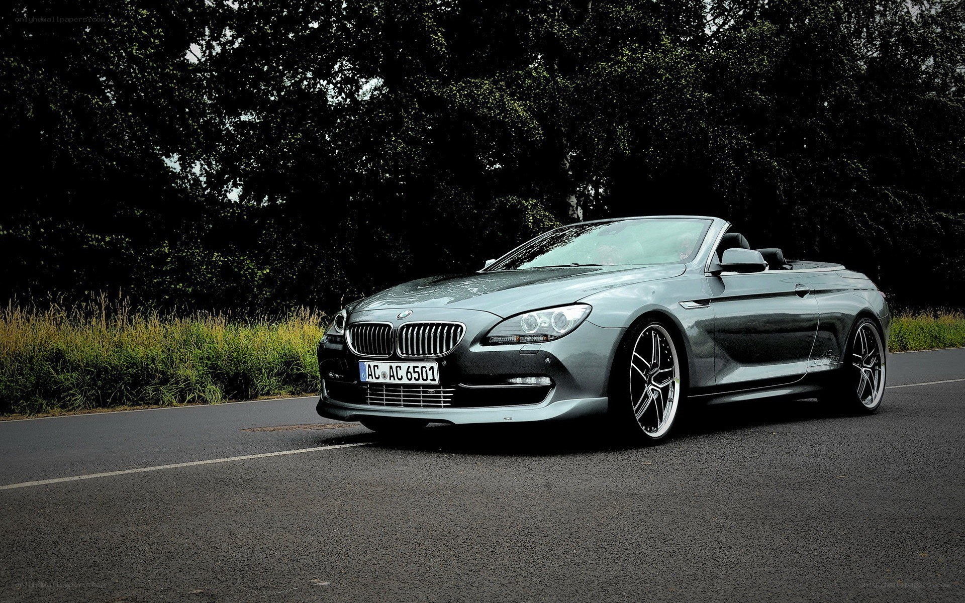 silver bmw convertible on road