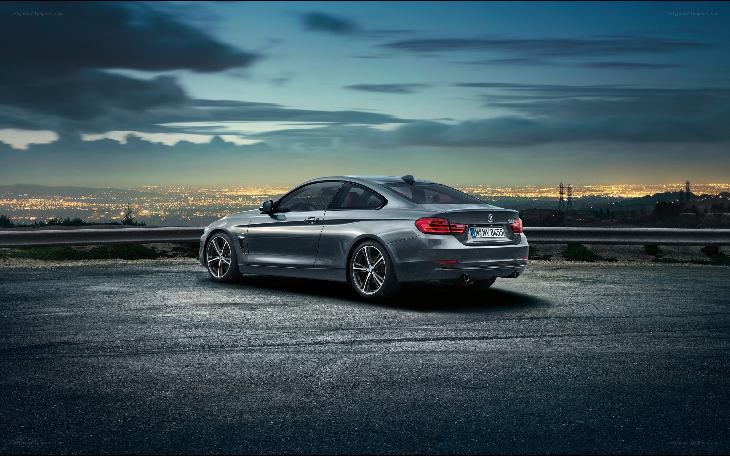 silver bmw coupe at dusk