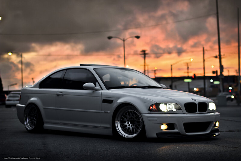 silver bmw coupe at sunset