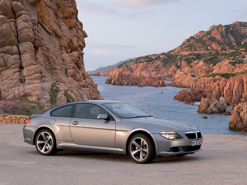 Silver BMW coupe by the coast