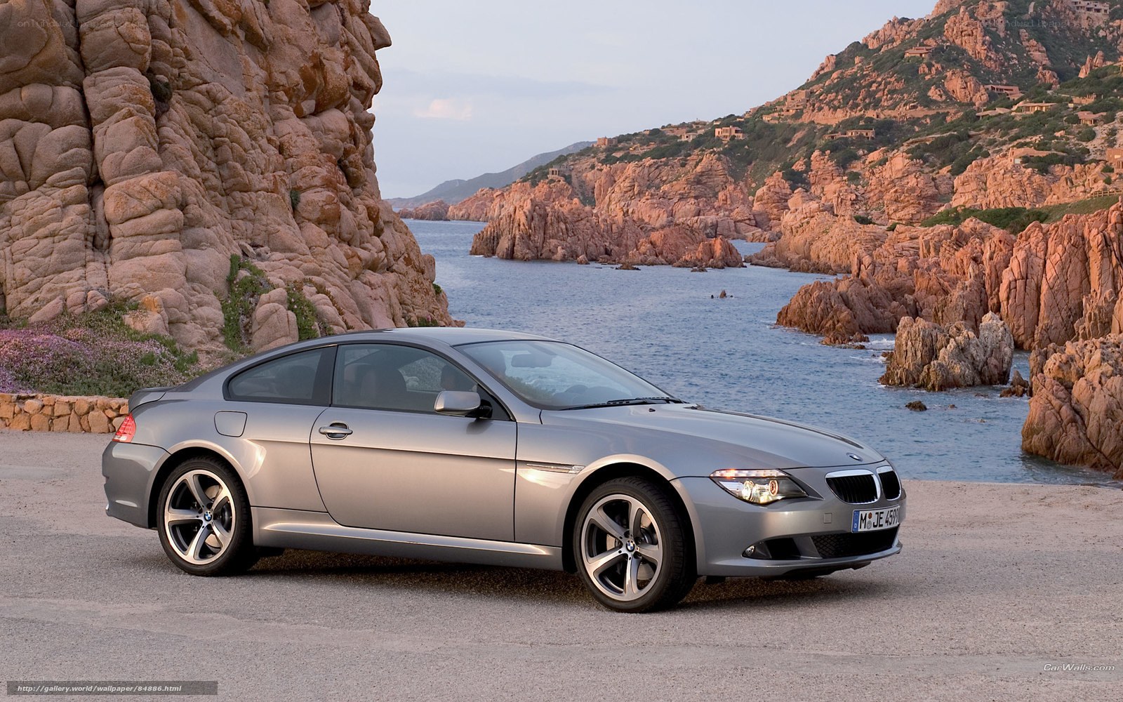 silver bmw coupe by the coast
