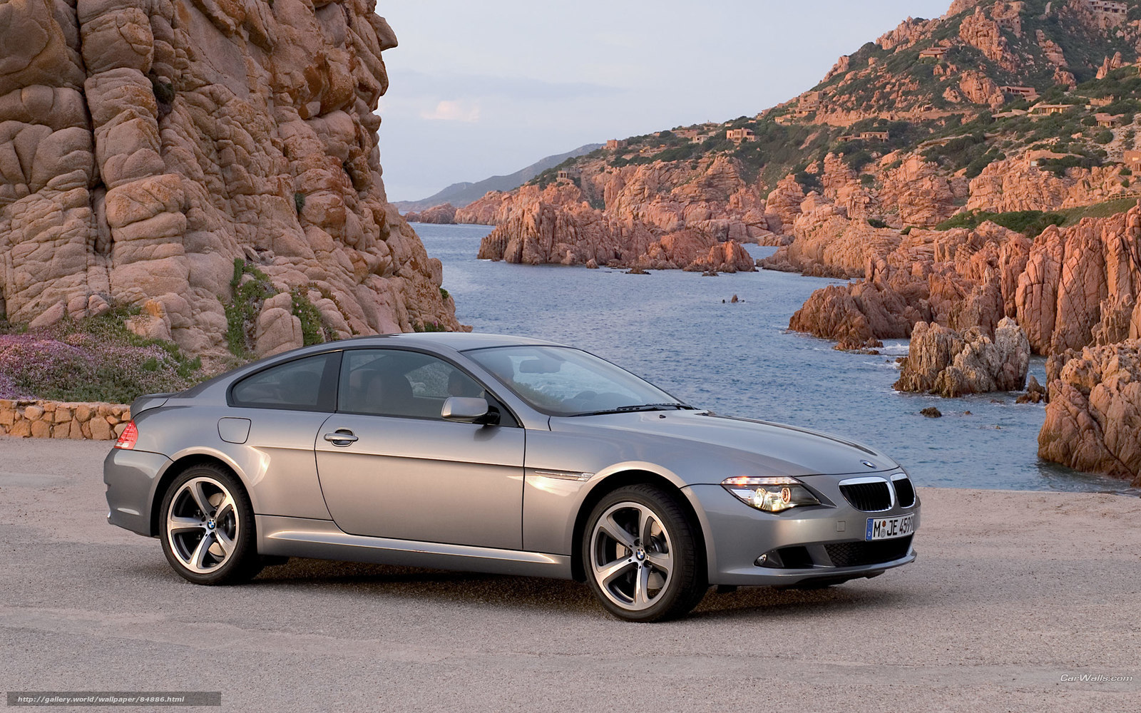 silver bmw coupe by the coast