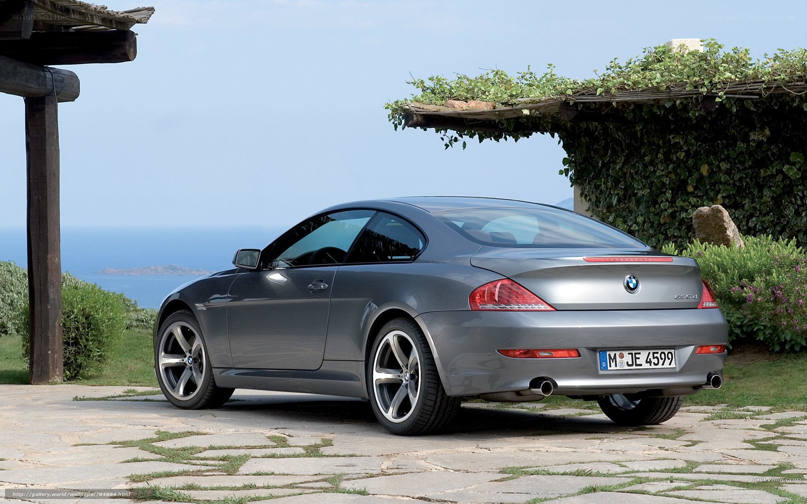silver bmw coupe by the sea