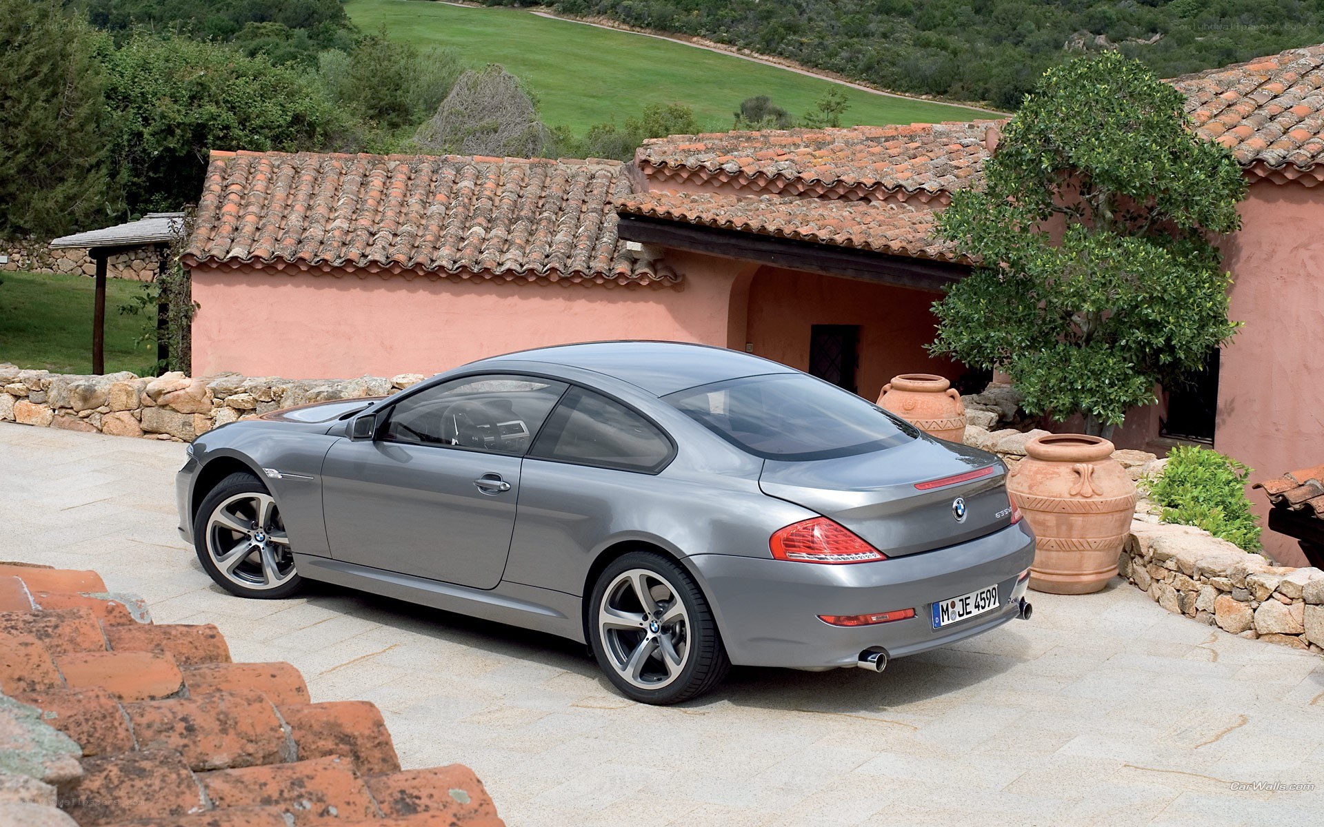 silver bmw coupe in courtyard