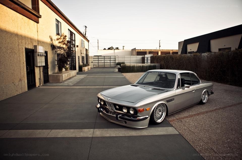 silver bmw coupe in courtyard