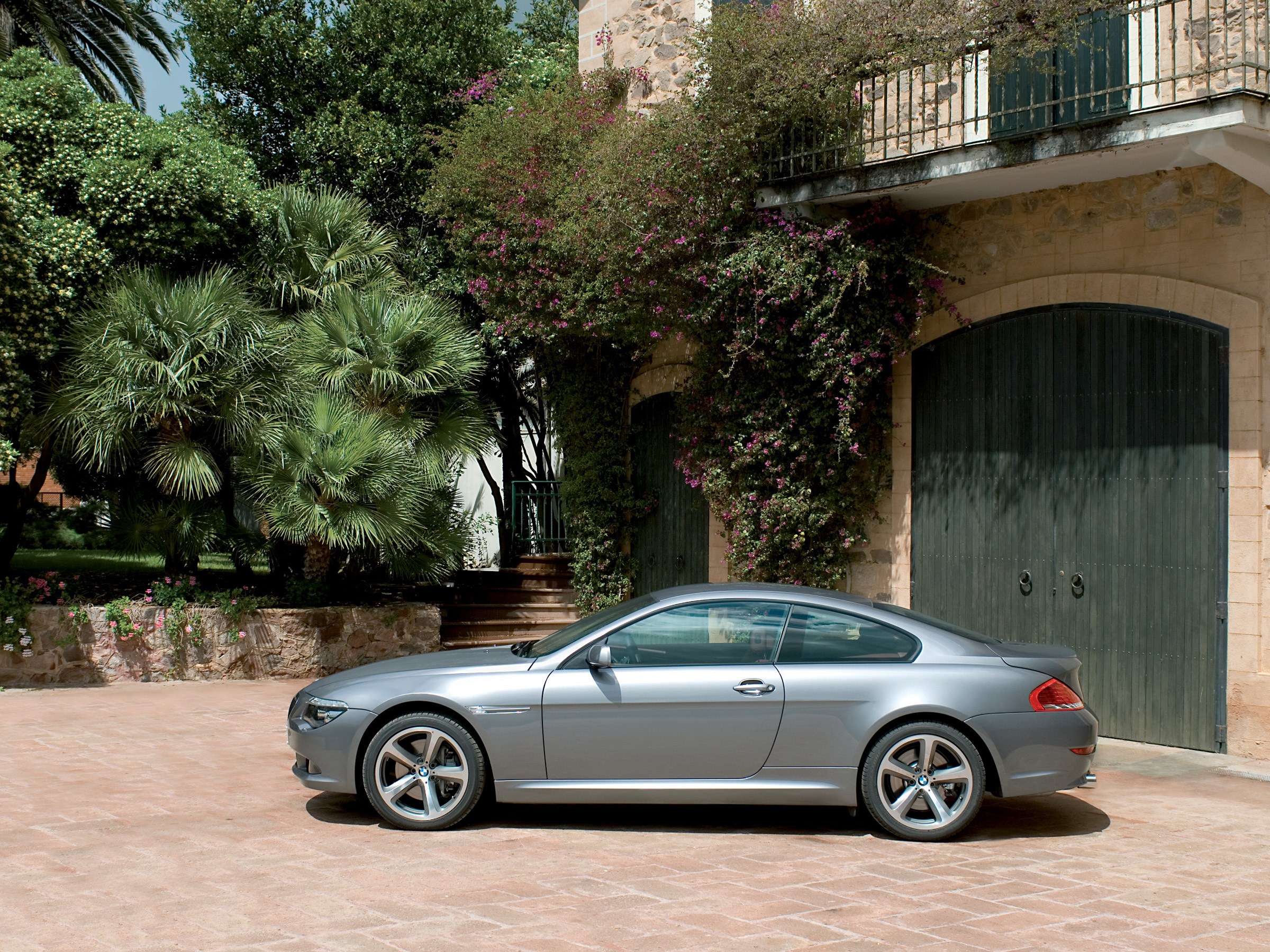Silver BMW coupe in courtyard