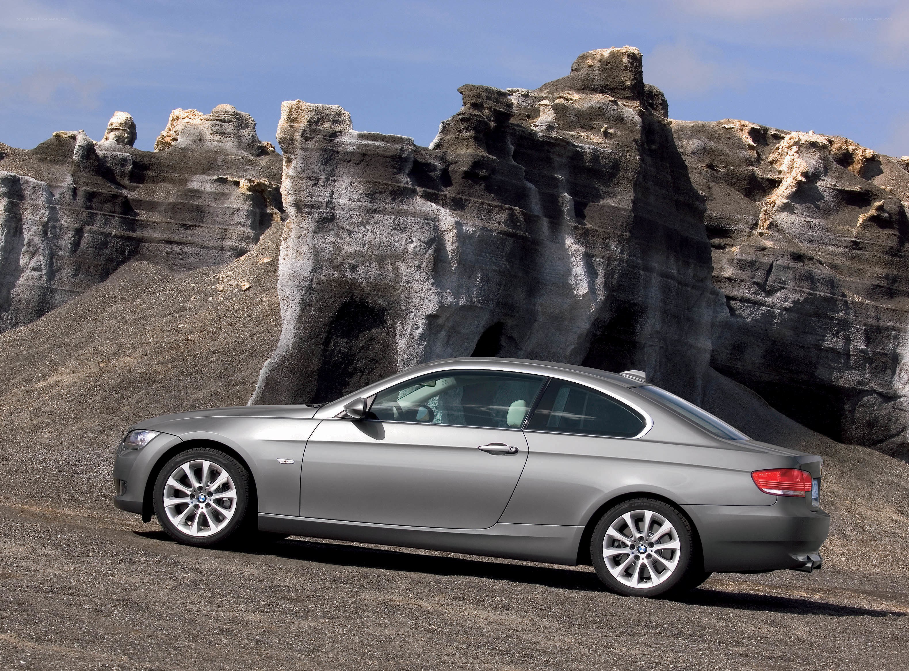 Silver BMW coupe in desert