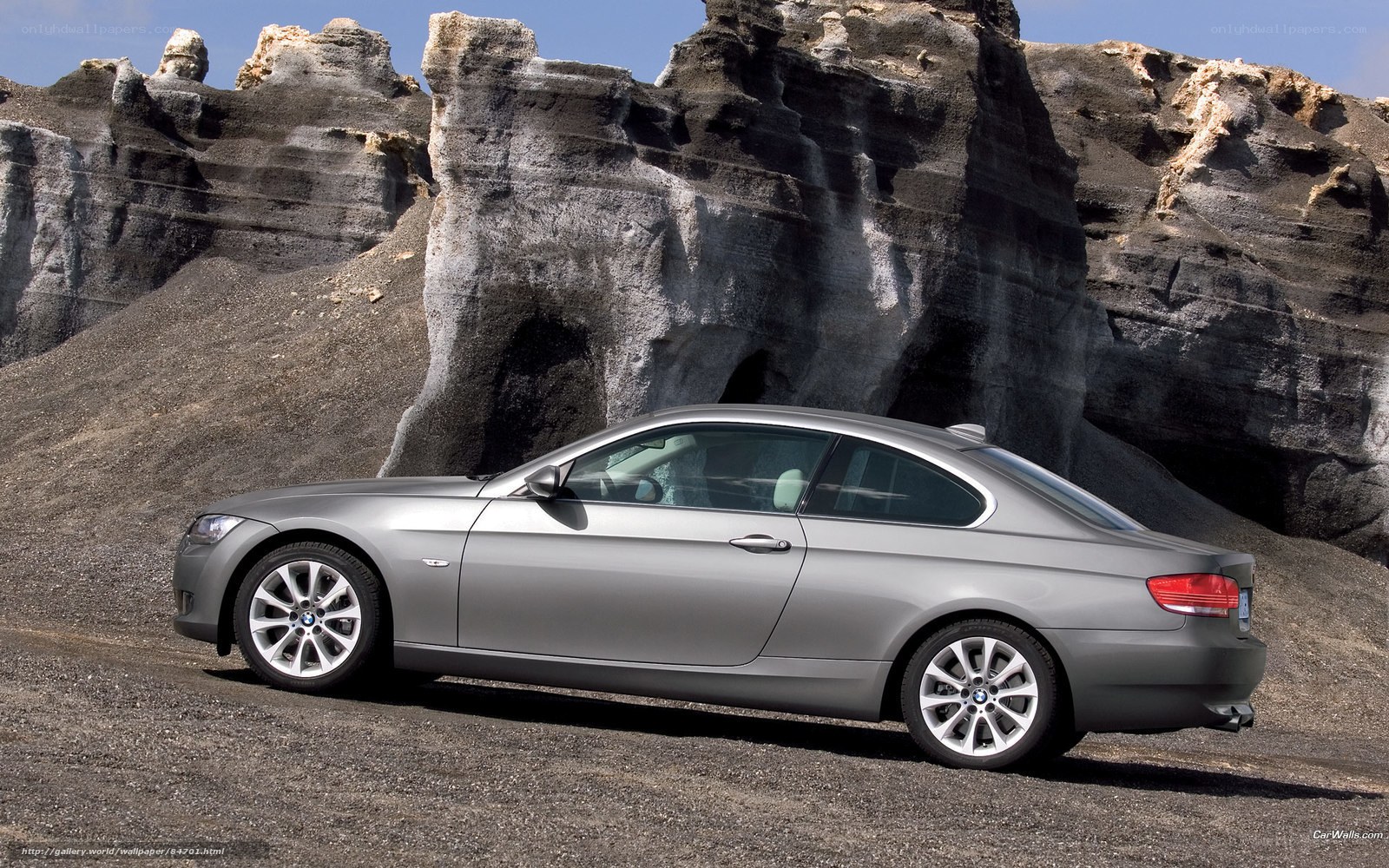 silver bmw coupe in desert