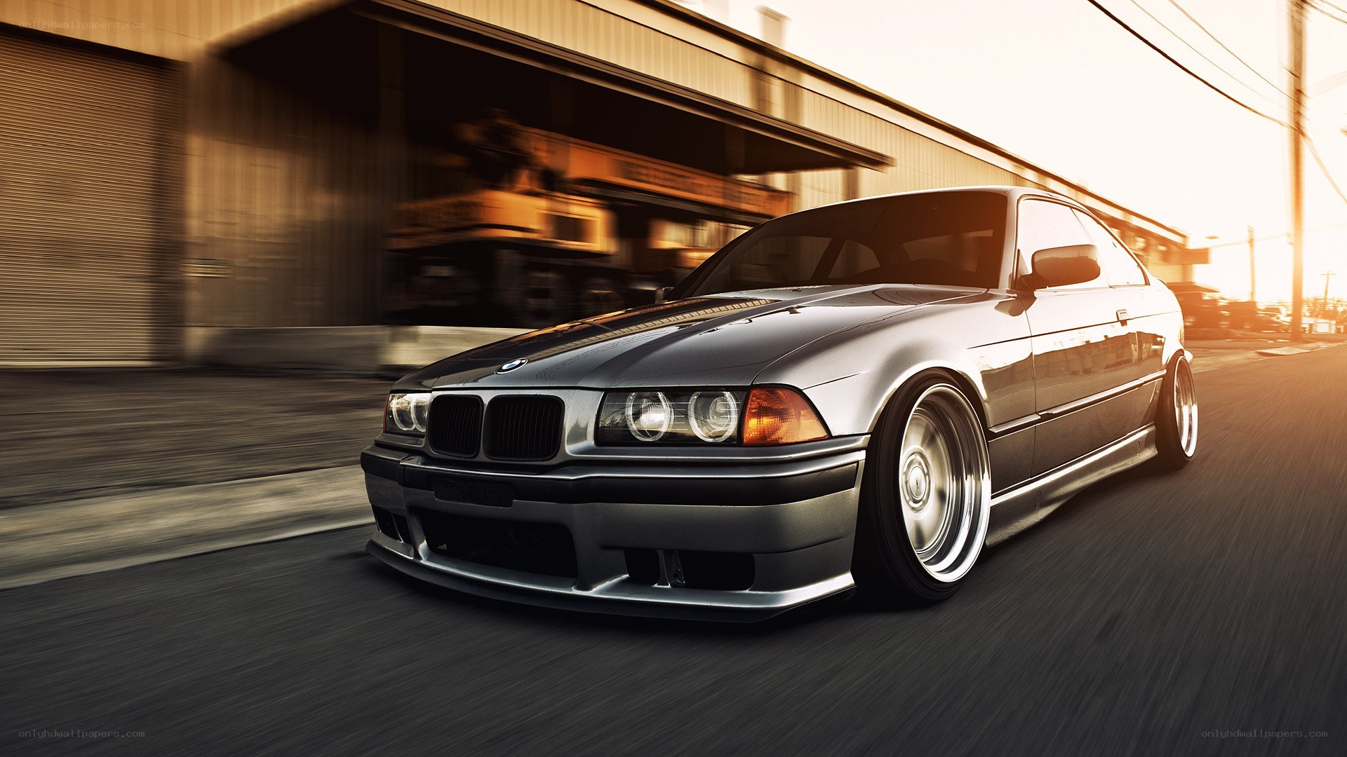 silver bmw coupe in motion