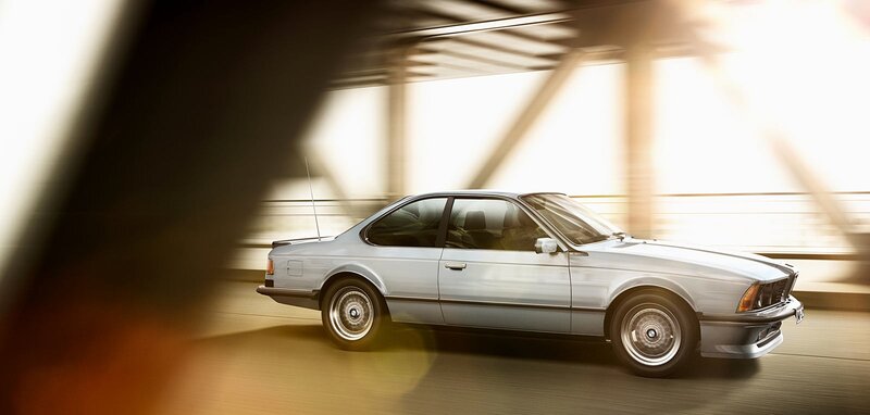 silver bmw coupe in motion