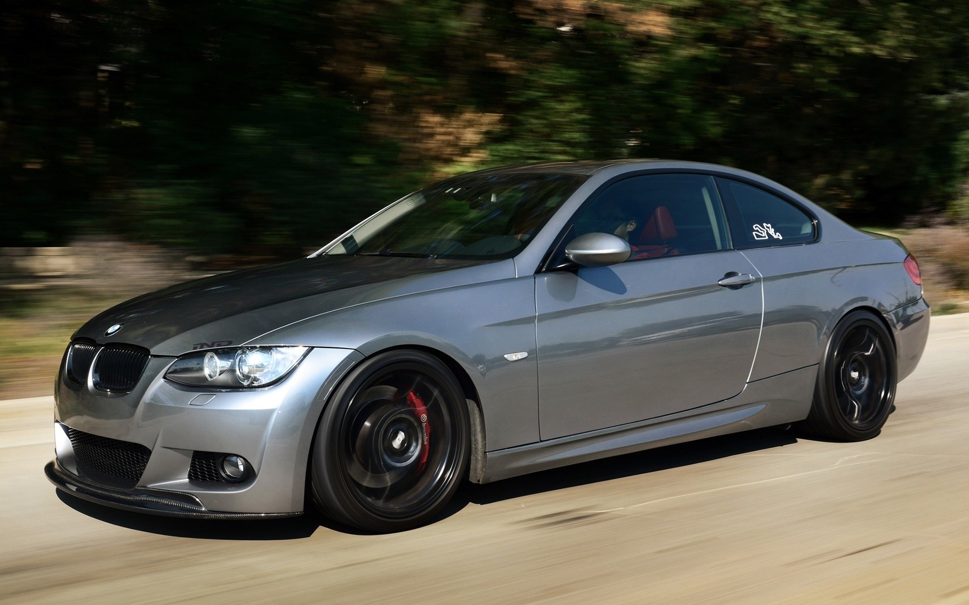 silver bmw coupe in motion
