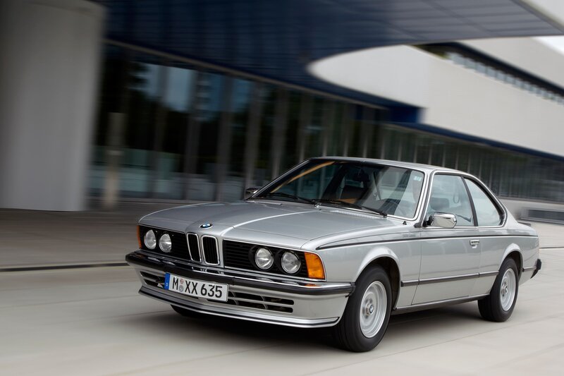 silver bmw coupe in motion