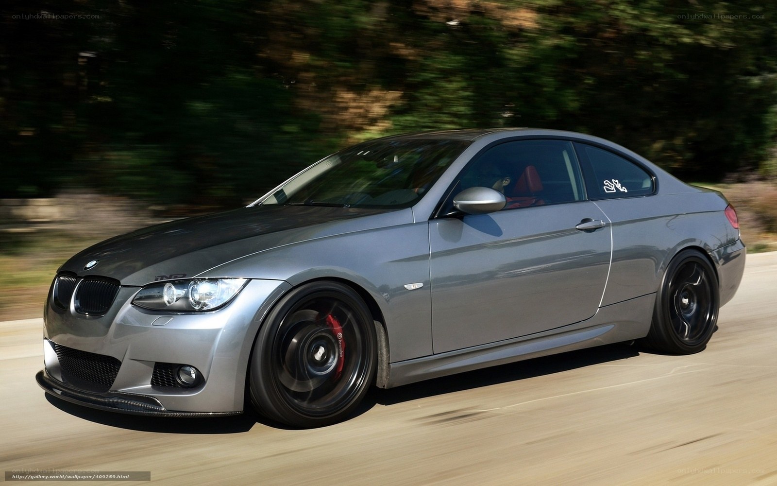 silver bmw coupe in motion