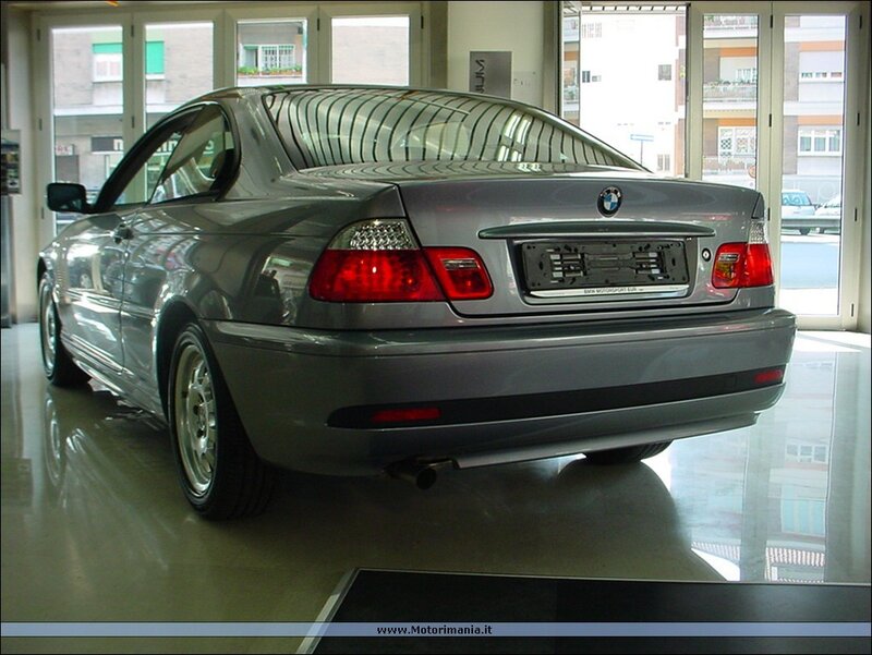 silver bmw coupe in showroom