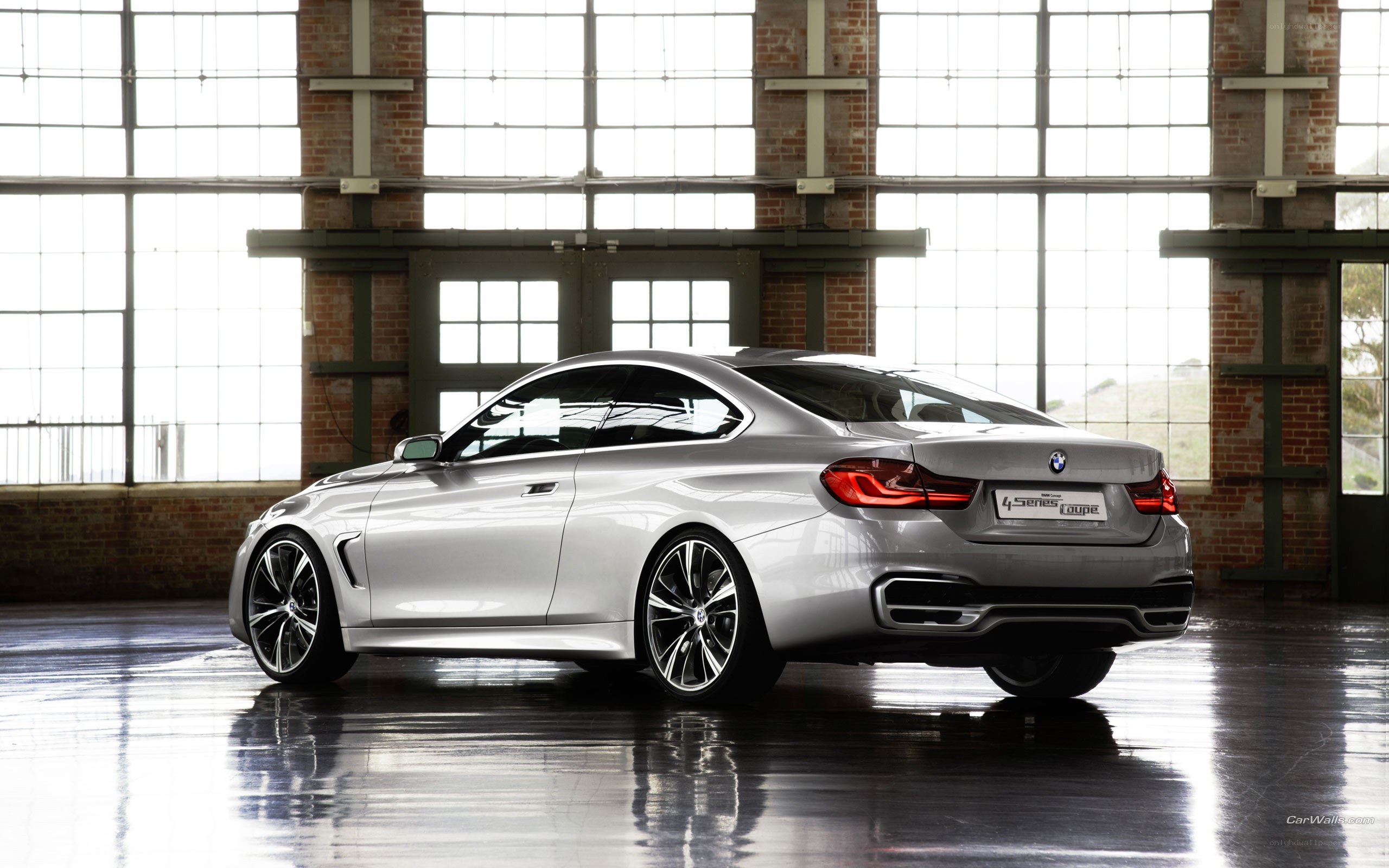 silver bmw coupe in warehouse