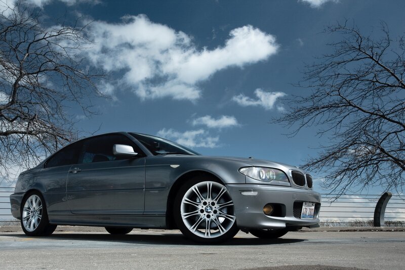 silver bmw coupe on a sunny day