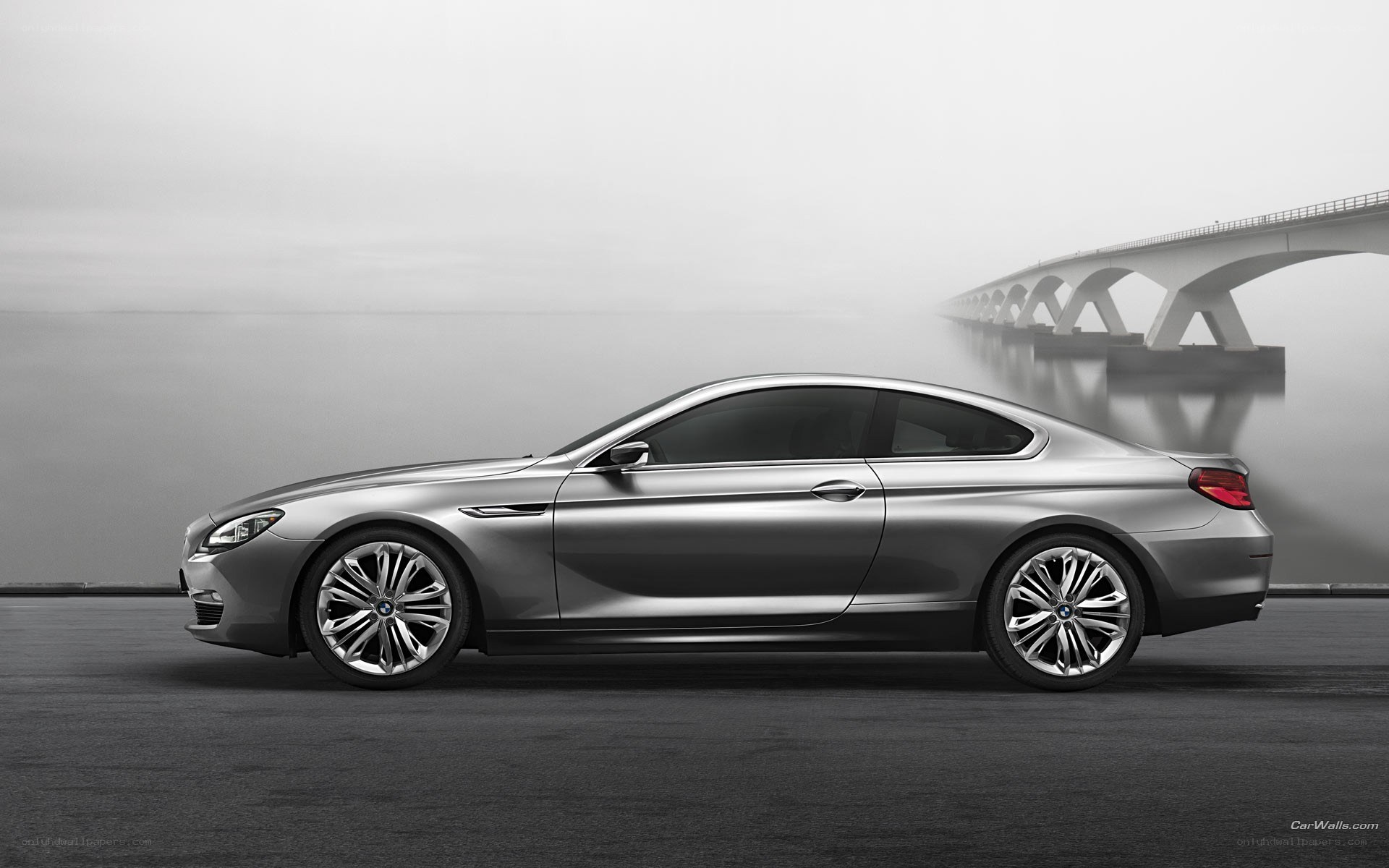 silver bmw coupe on bridge