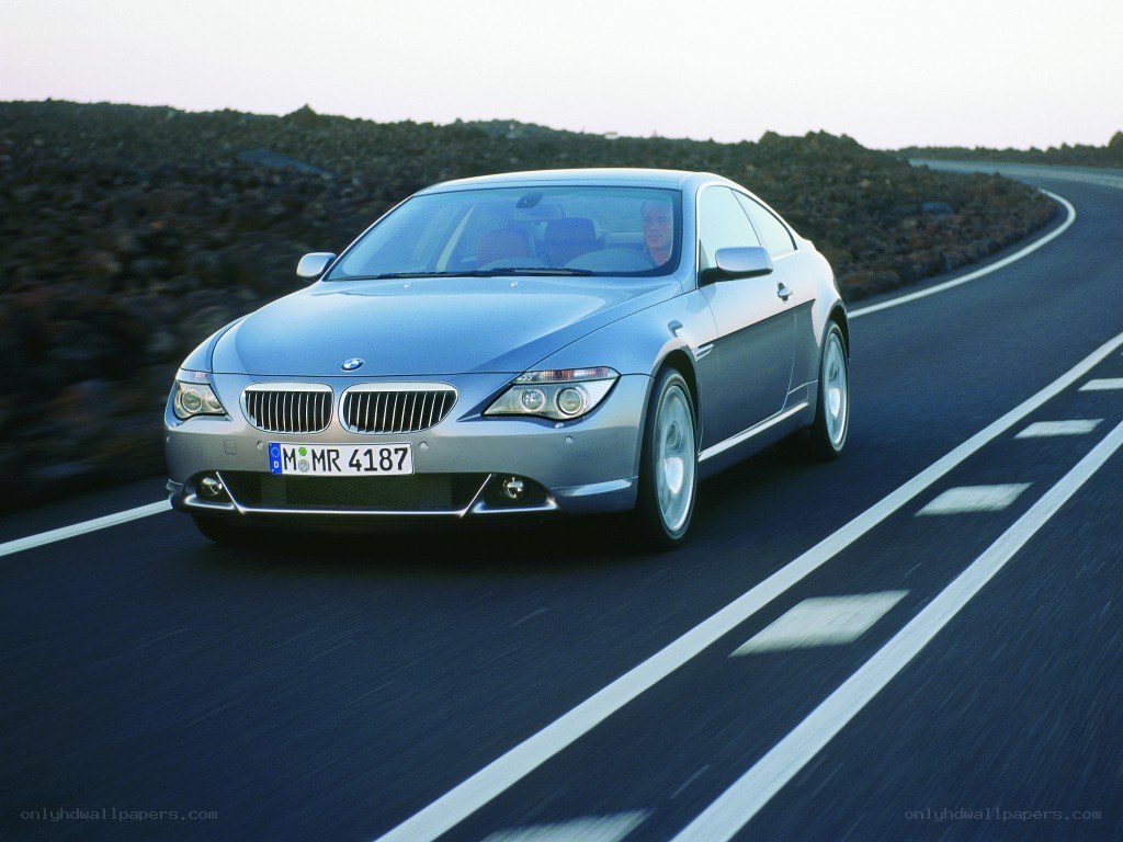 silver bmw coupe on road