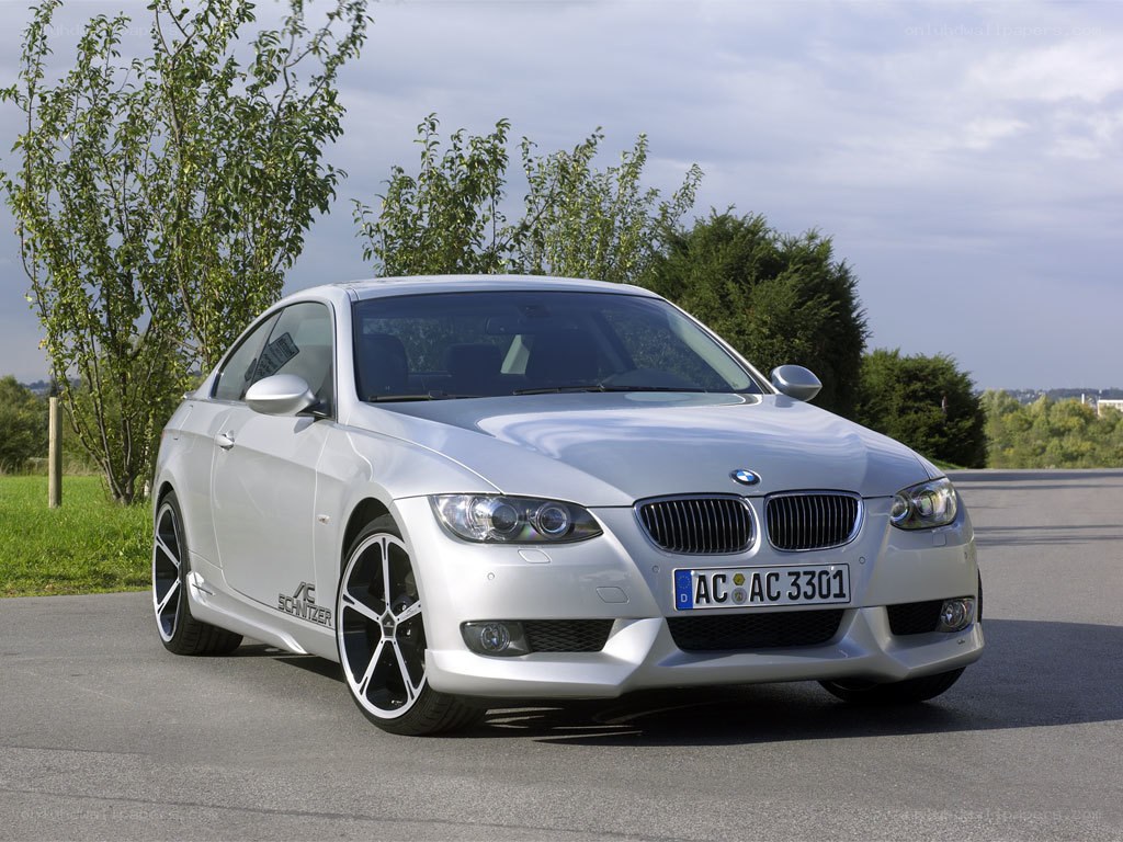 silver bmw coupe on road