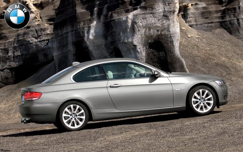 silver bmw coupe on rocky terrain
