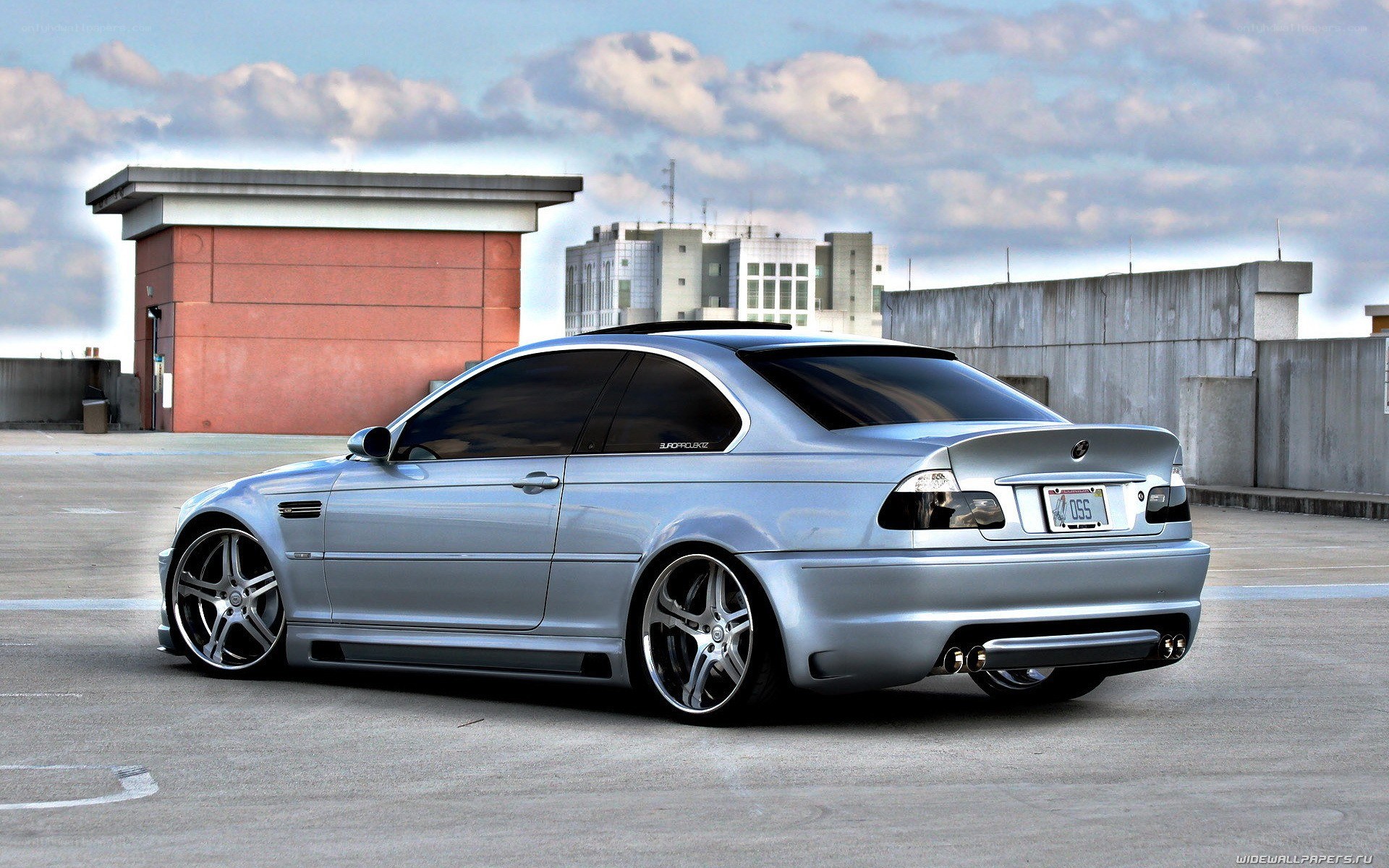 silver bmw coupe on rooftop