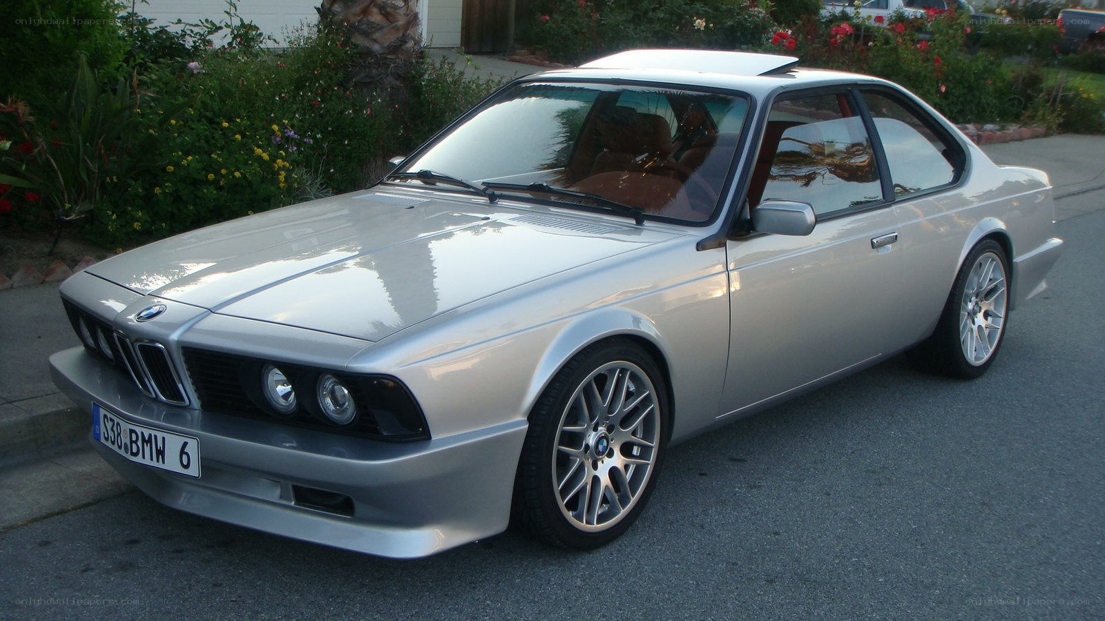 silver bmw coupe on street