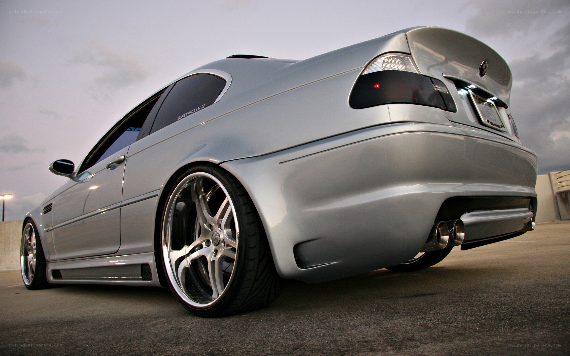 silver bmw coupe with custom wheels
