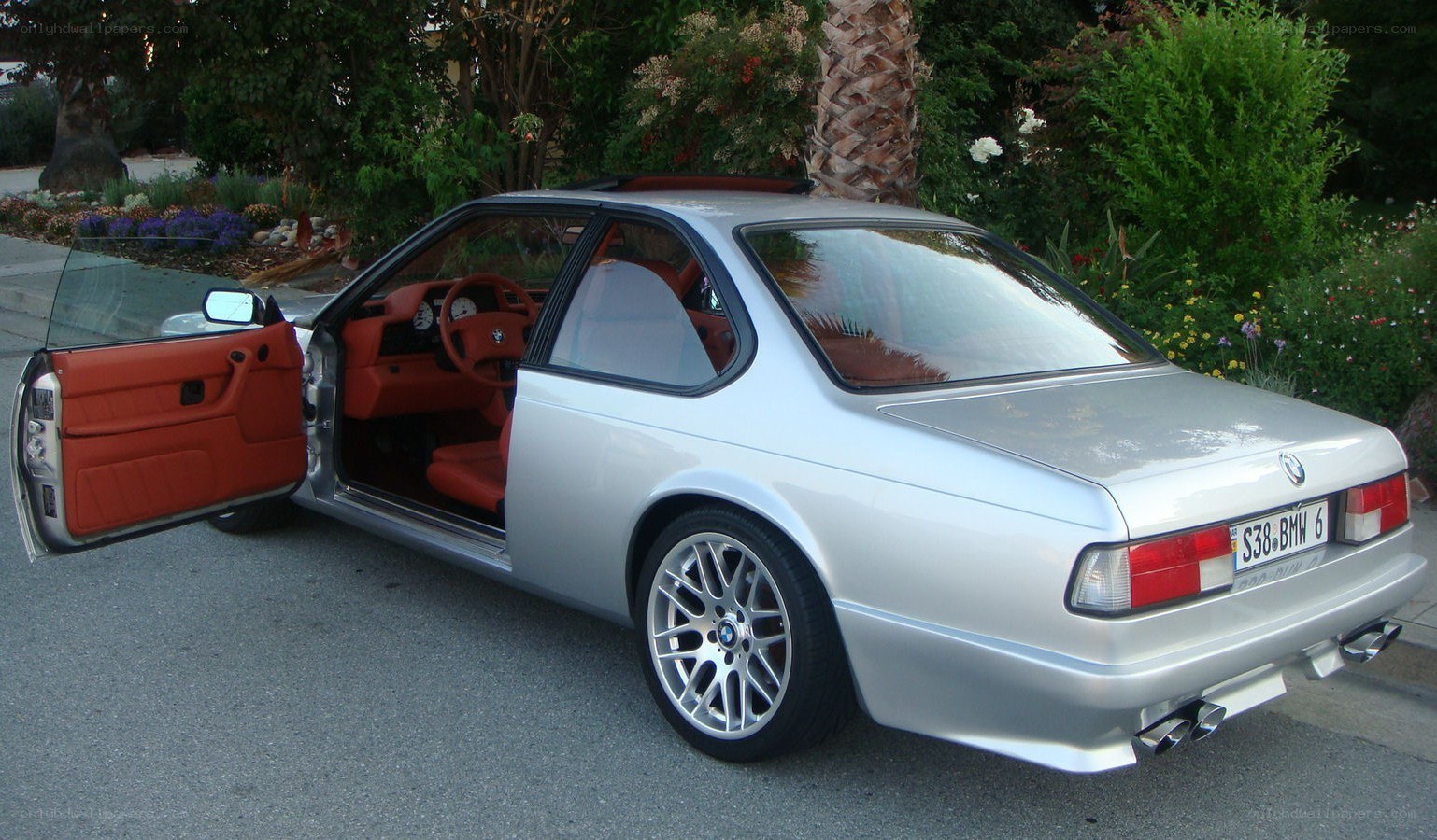 silver bmw coupe with red interior