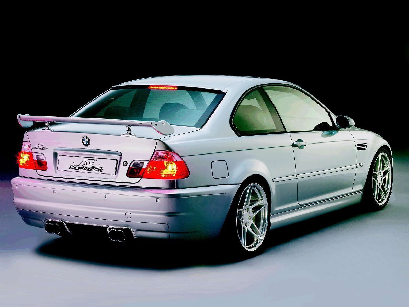 silver bmw coupe with spoiler
