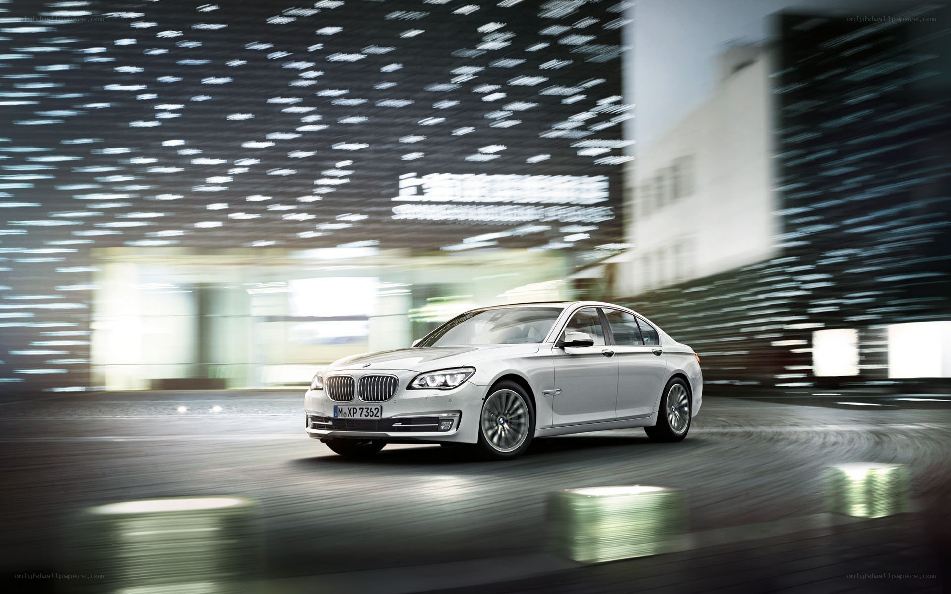 silver bmw driving at night
