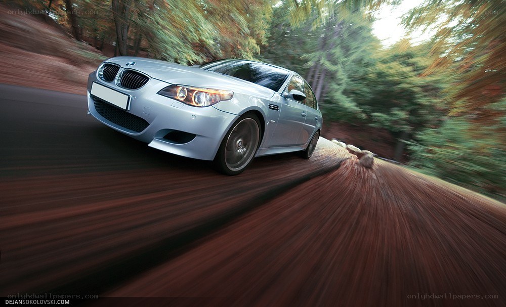 silver bmw driving fast