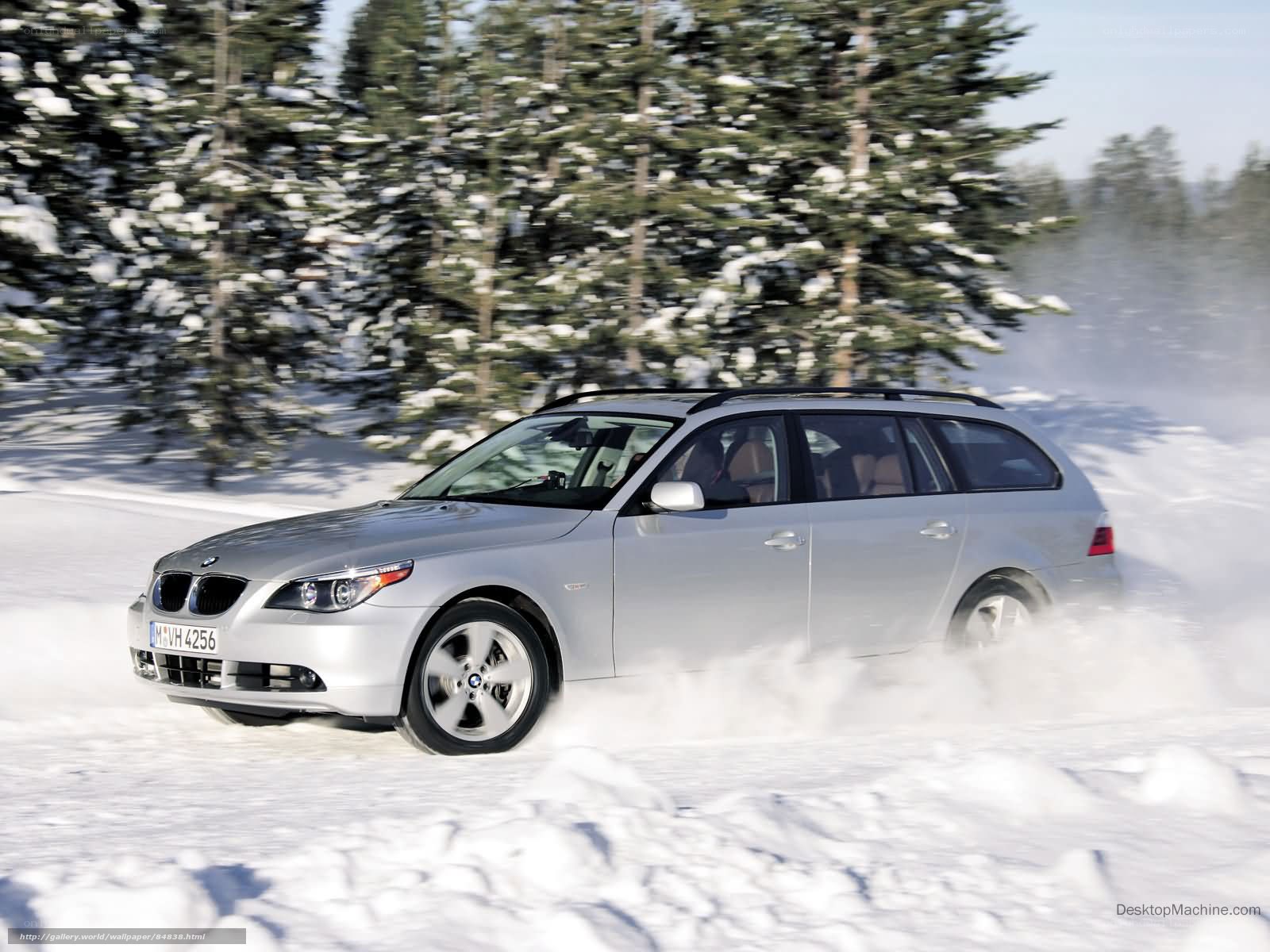 silver bmw driving in snow