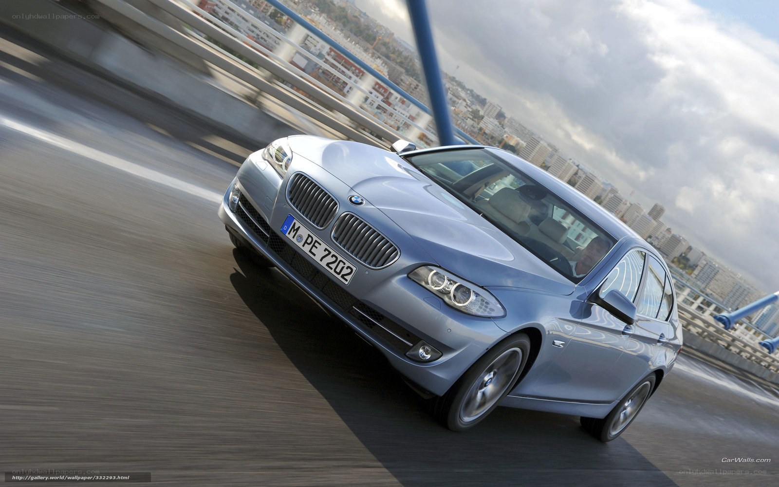 silver bmw driving on bridge
