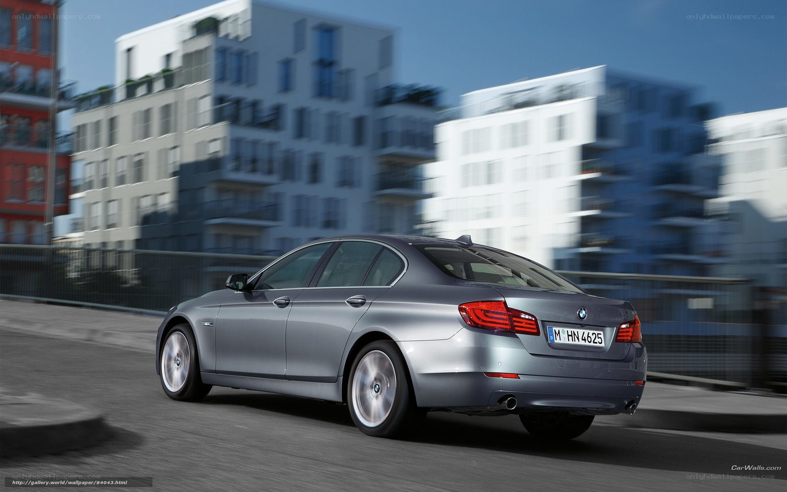 silver bmw driving on city street