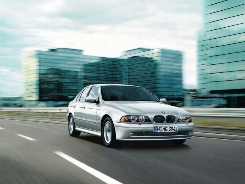 silver bmw driving on highway