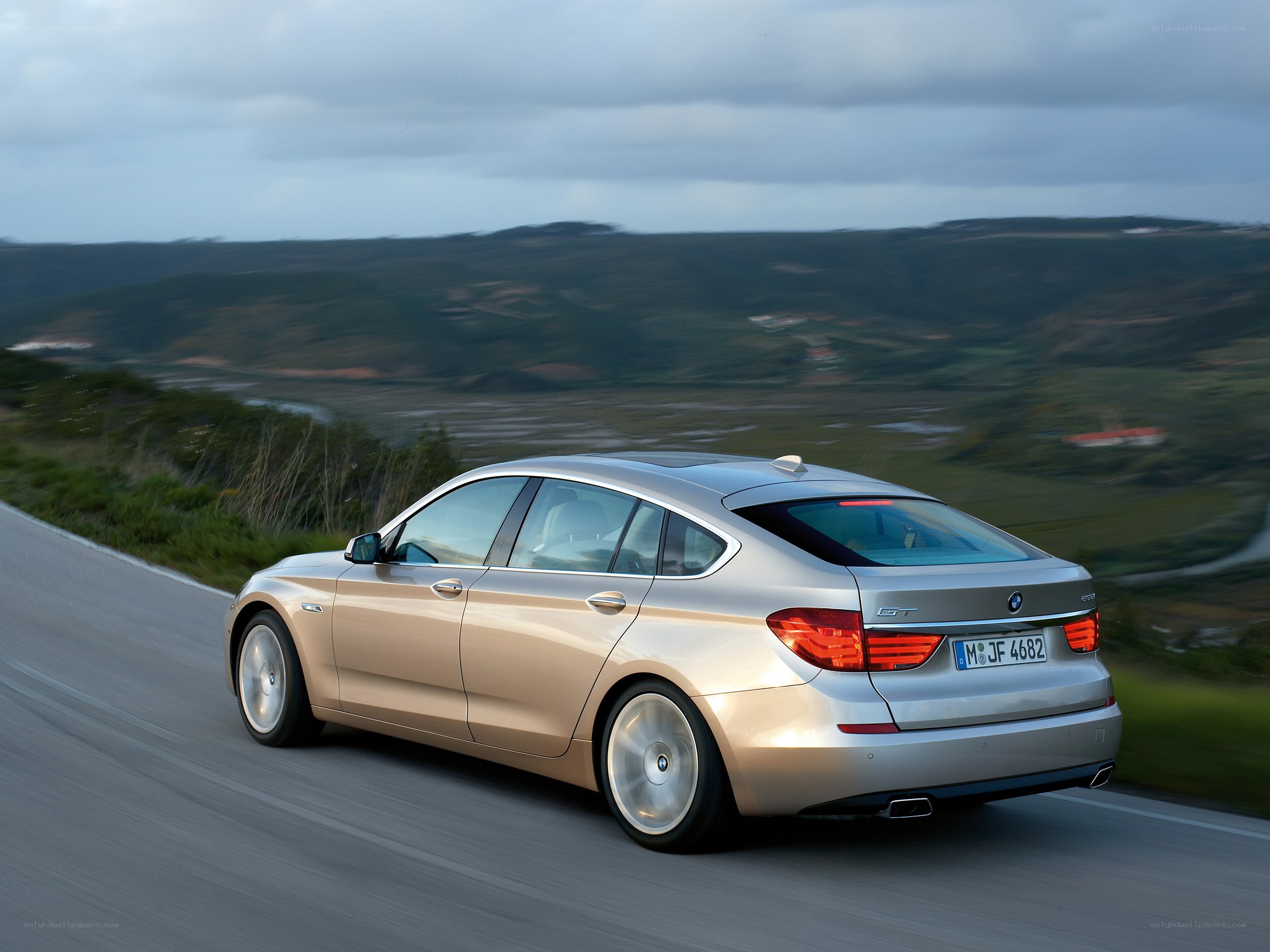 silver bmw driving on road