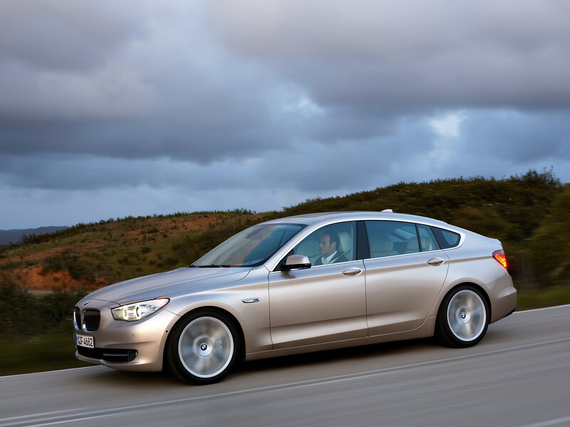 silver bmw driving on road