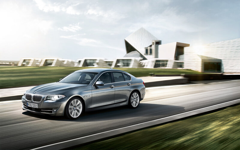 silver bmw driving on road