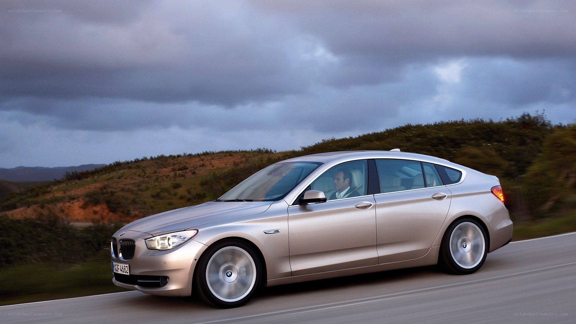 silver bmw driving on road