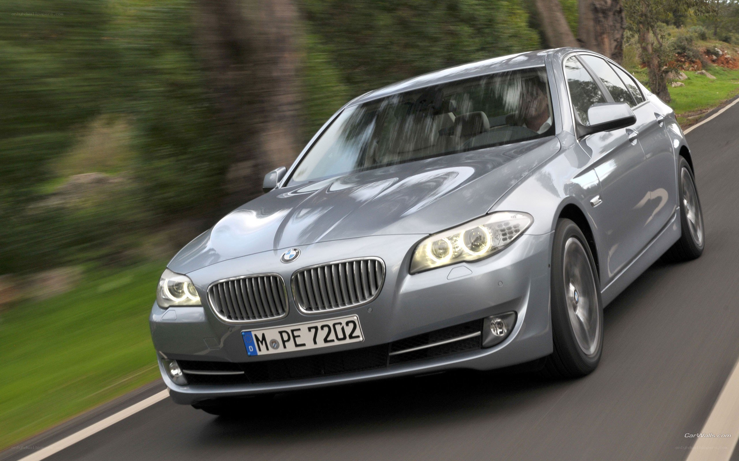 silver bmw driving on road
