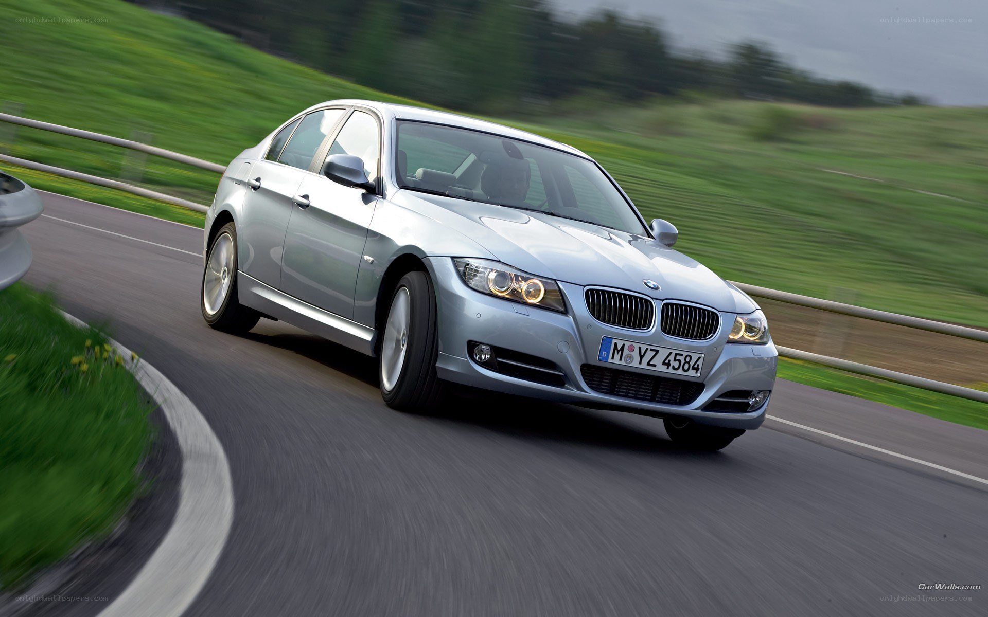 silver bmw driving on road