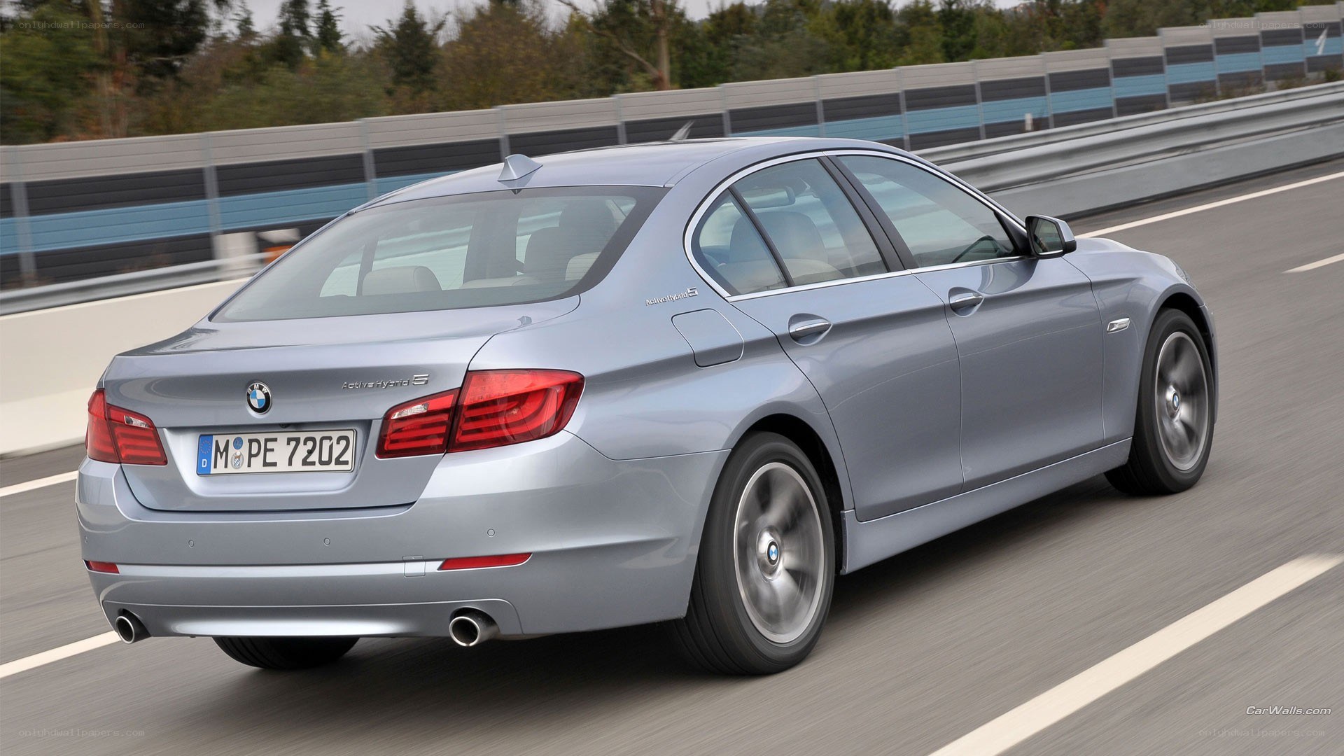 silver bmw driving on road